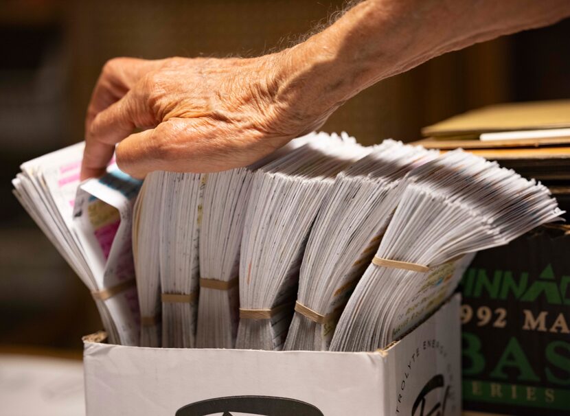 James Thruston, 84, looks through his box where he records his daily stretches on Friday,...