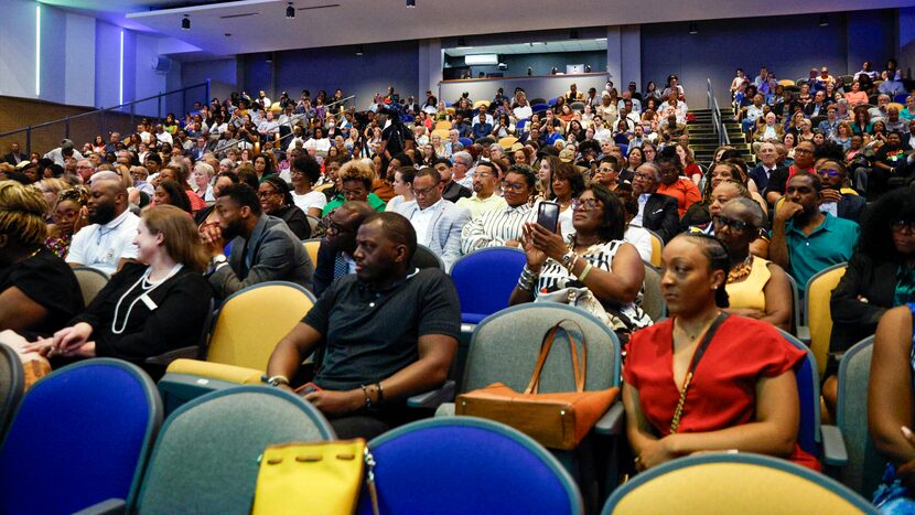 Attendees listen to a discussion with Opal Lee, known as the grandmother of Juneteenth, and...