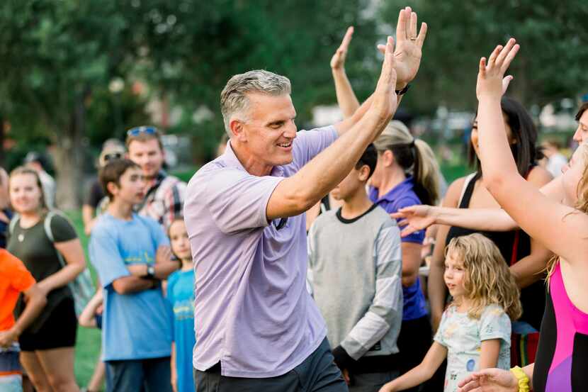 Steve Neeleman, HealthEquity's founder and vice chair, gave high fives to team members and...