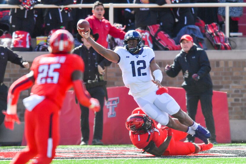 LUBBOCK, TX - NOVEMBER 18: Shawn Robinson #12 of the TCU Horned Frogs throws the ball away...