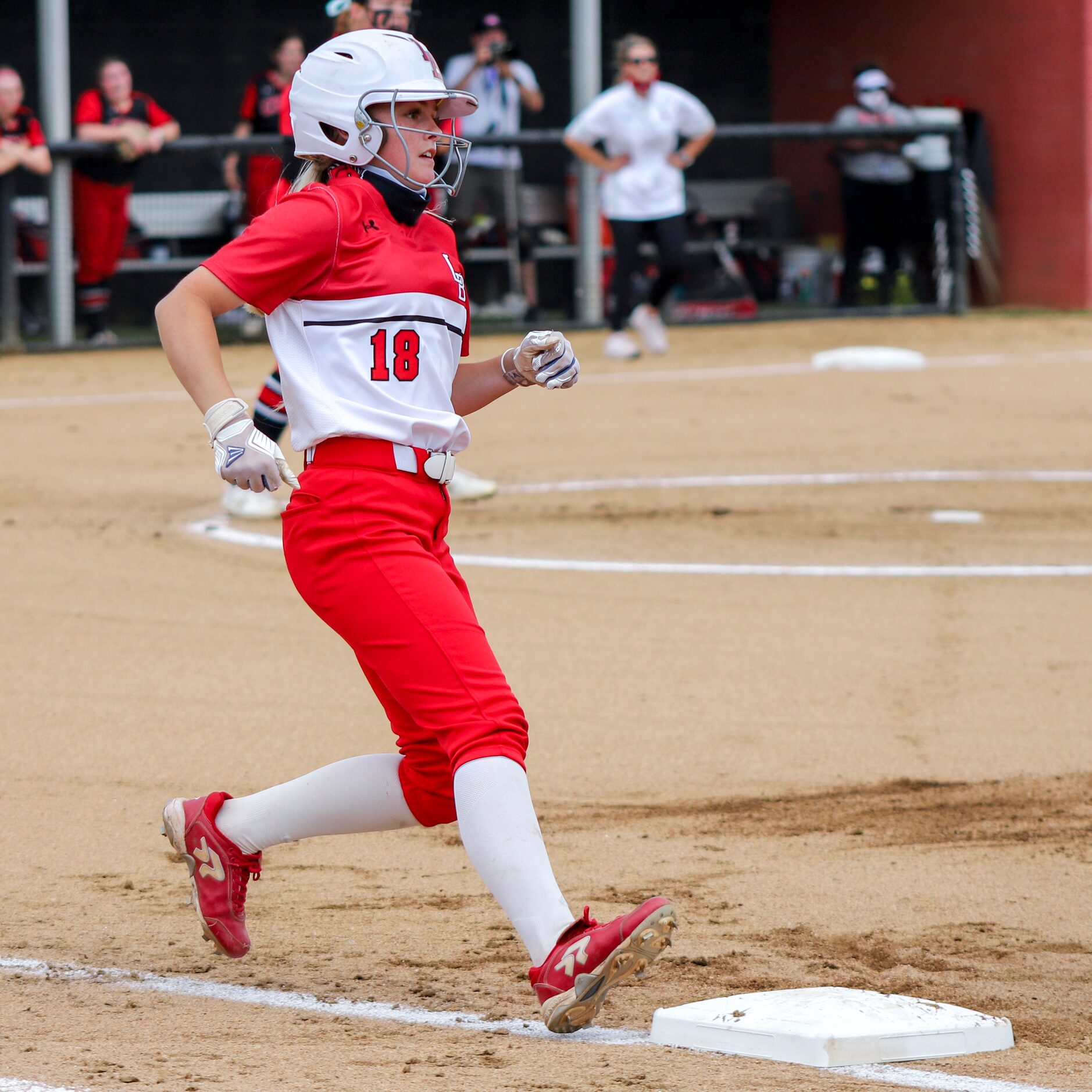 Mansfield Legacy shortstop Hope Lusk (18) safely reaches first base after a hit during a...