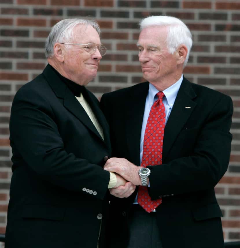 In 2007, Cernan (right) congratulated former astronaut Neil Armstrong at the dedication...