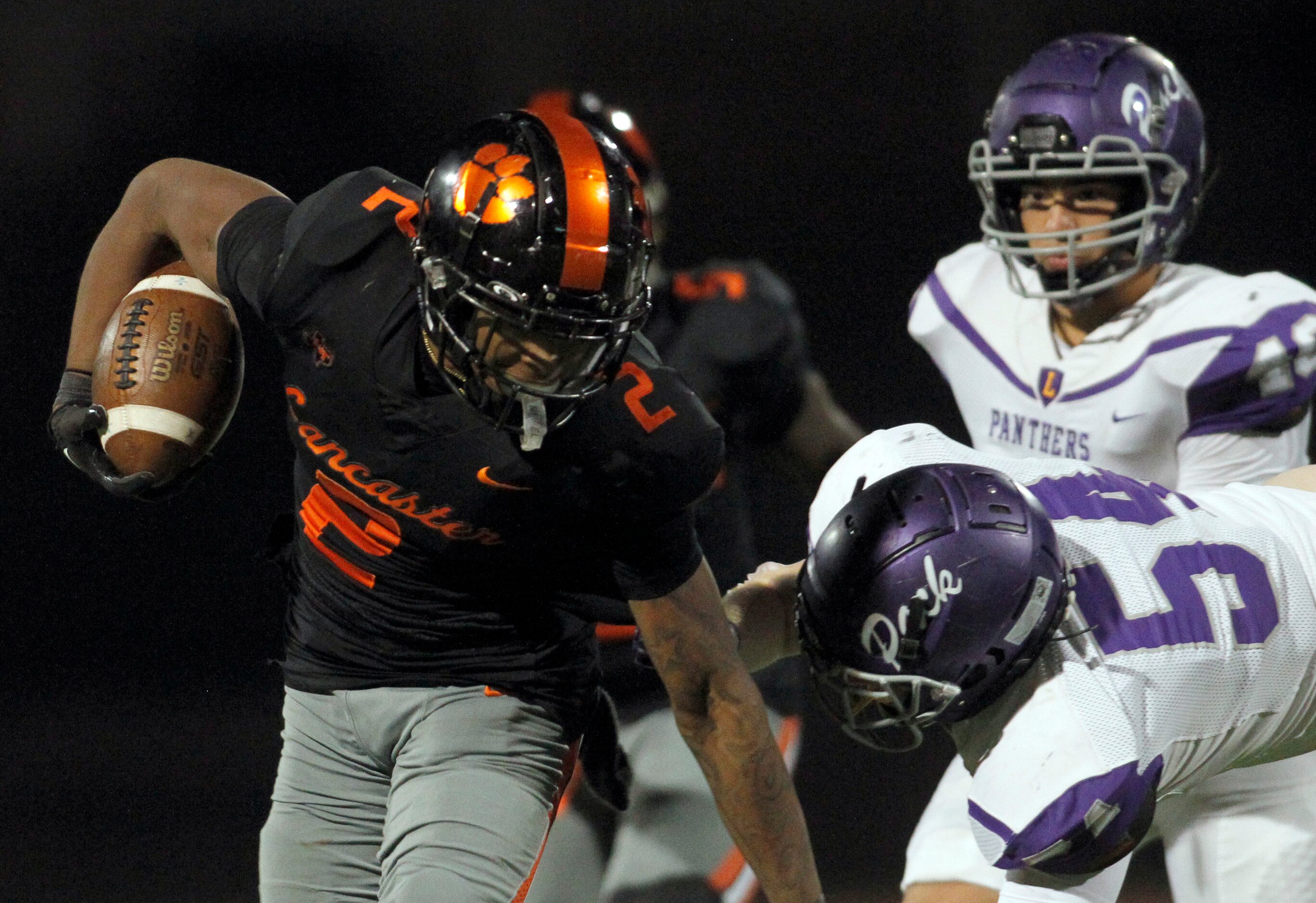 Lancaster running back Kewan Lacy (2), left, carries the ball close to the goal line before...