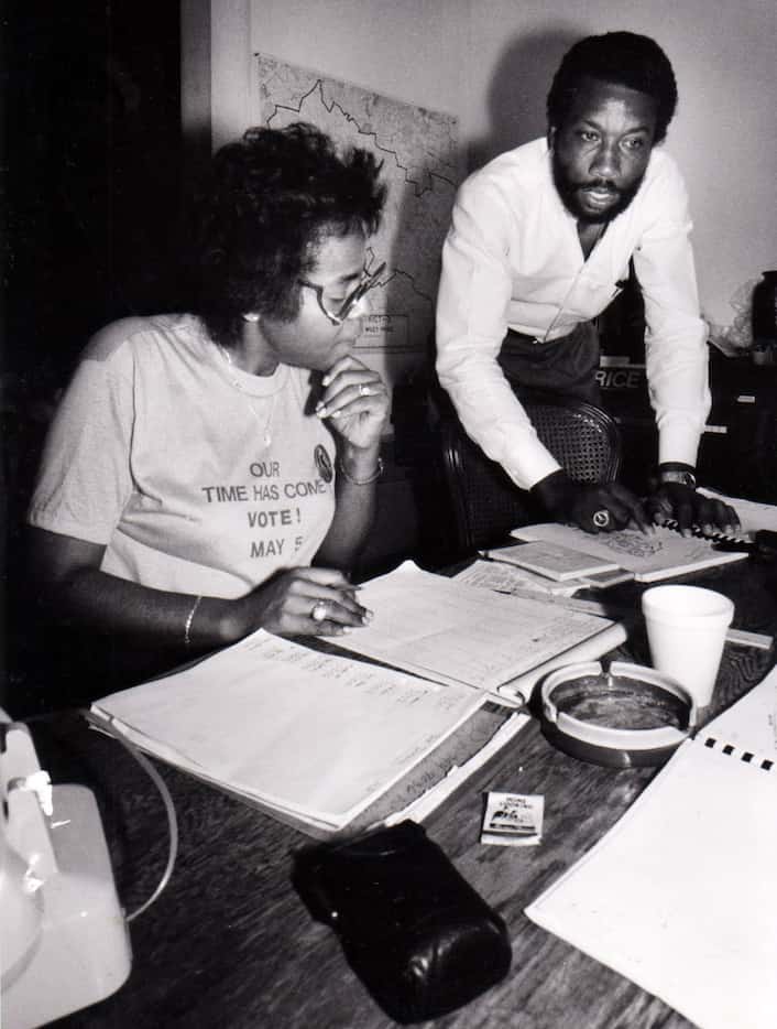 In an undated photo, John Wiley Price looks over election returns with campaign worker Betty...