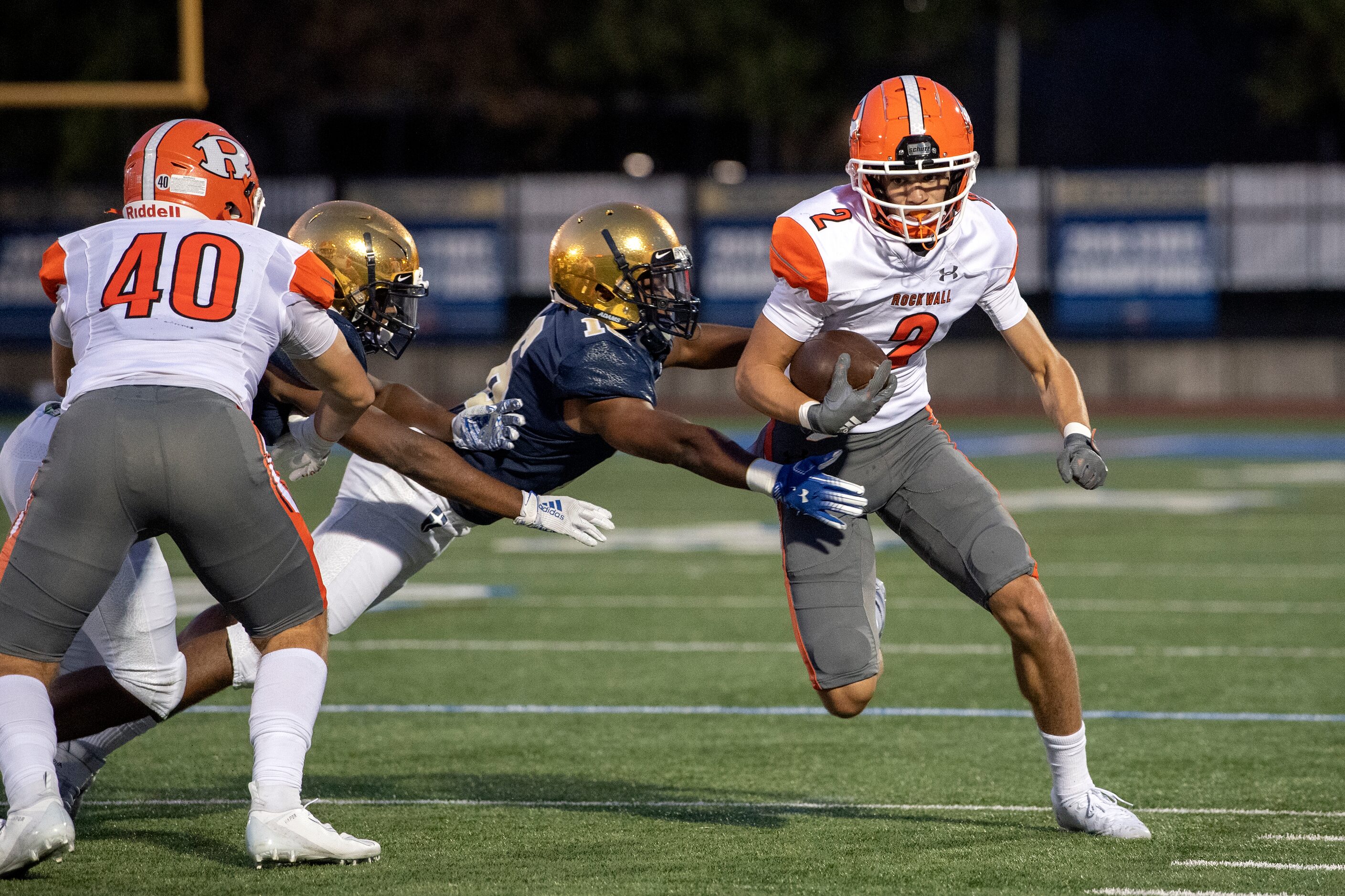 Rockwall senior wide receiver Brenden Bayes (2) runs past Jesuit senior defensive back Chase...