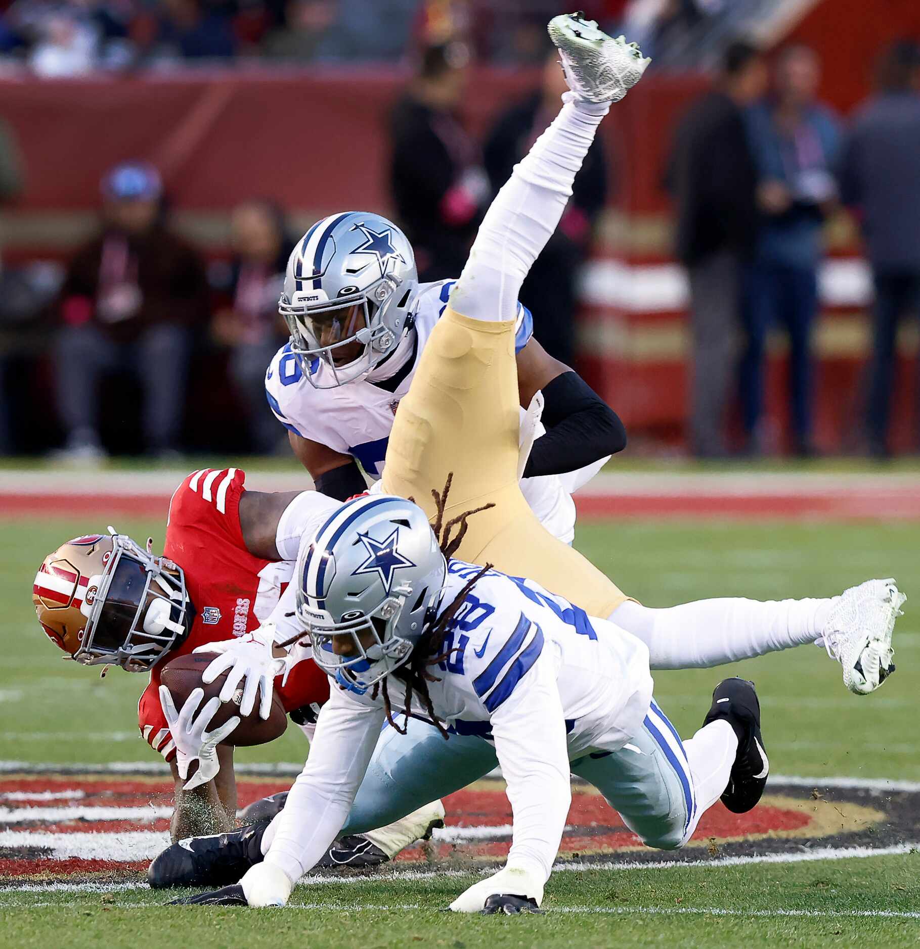 San Francisco 49ers wide receiver Deebo Samuel (19) is upended by Dallas Cowboys safety...