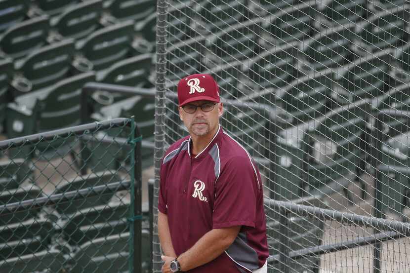 Frisco Roughriders pitching coach Jeff Andrews observes starting pitcher Chad Bell in the...