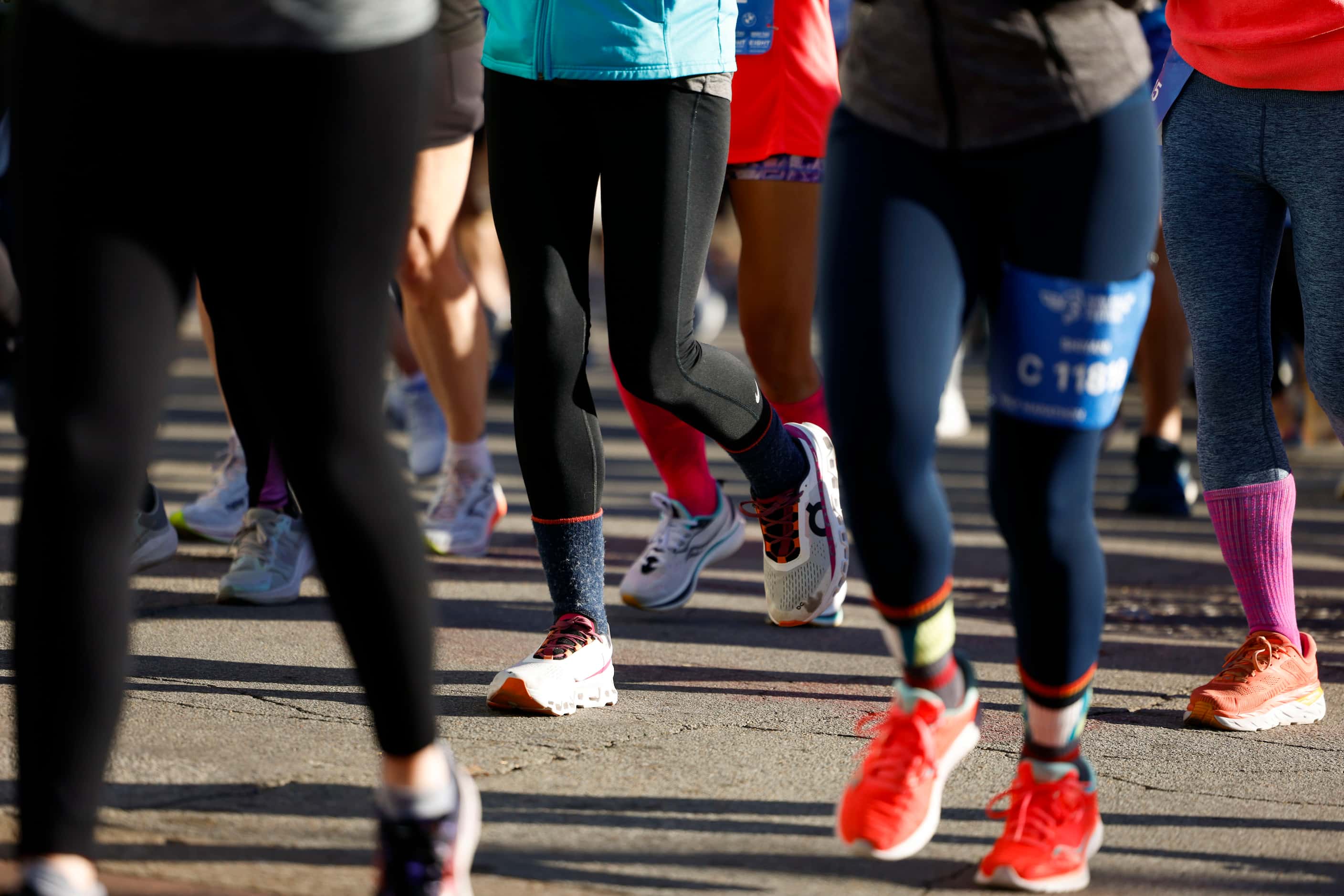 Runners goes along Young St. during 2023 BMW Dallas Marathon on, Sunday, Dec. 10, 2023, in...