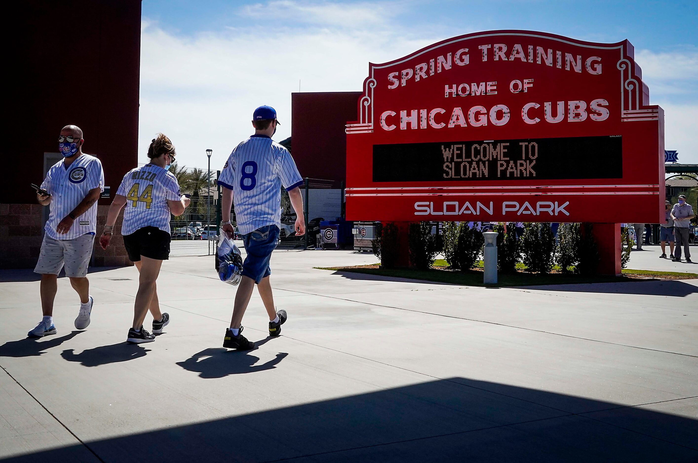 Fans walk on the concourse before a spring training game between the Texas Rangers and the...