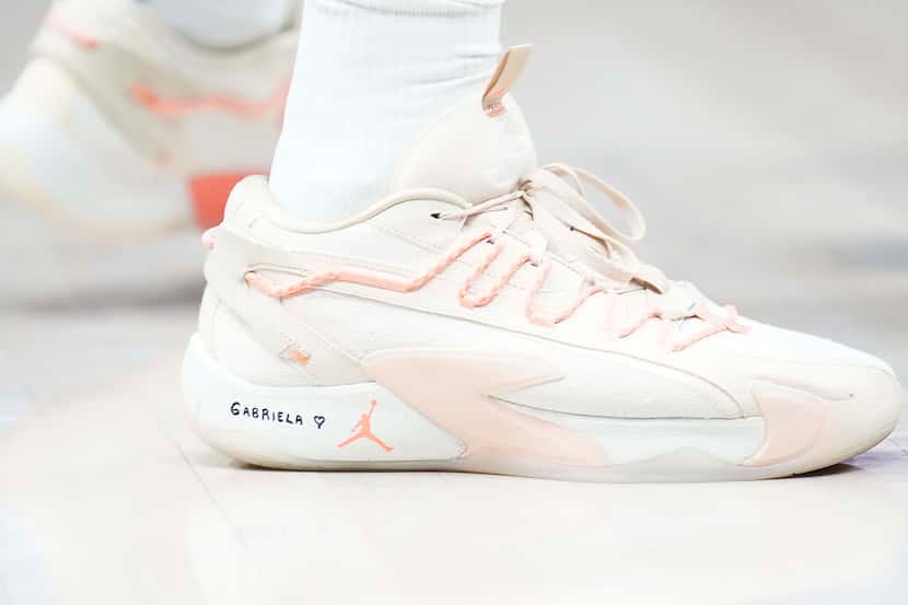 The name of his newborn daughter Gabriela are written on the shoes of Dallas Mavericks guard...