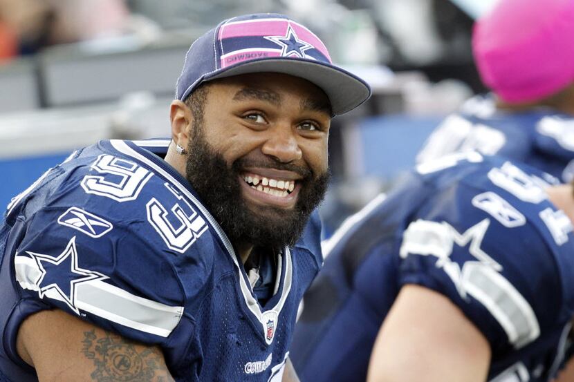 Dallas Cowboys outside linebacker Anthony Spencer (93) smiles on the bench in the first half...
