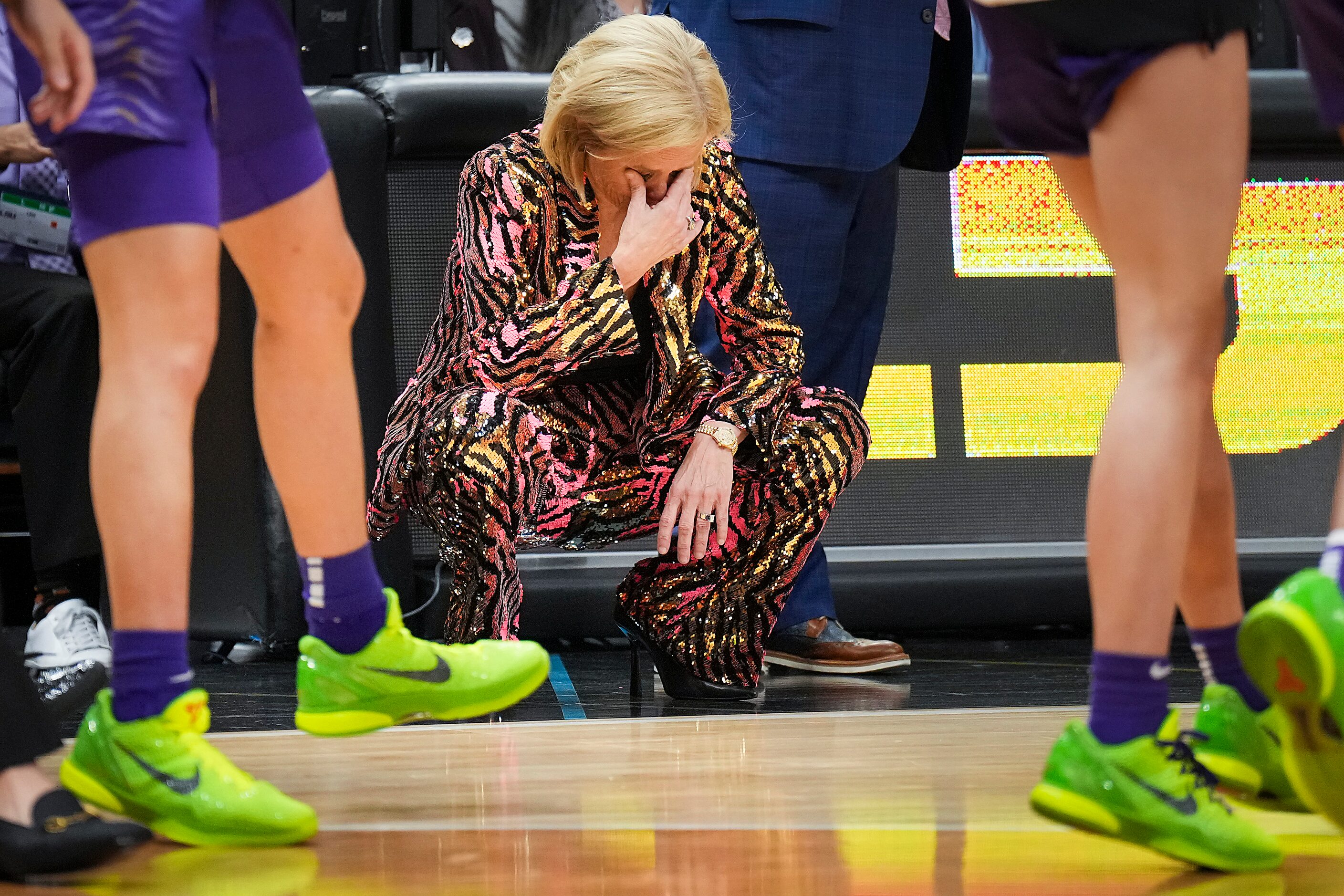 LSU head coach Kim Mulkey wipes away tears in the final minute of the second half of a...