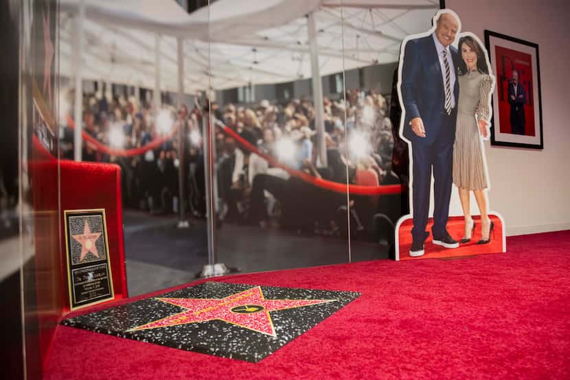 A replica of Dr. Phil’s Walk of Fame Star featuring a cutout of him and wife Robin McGraw in...