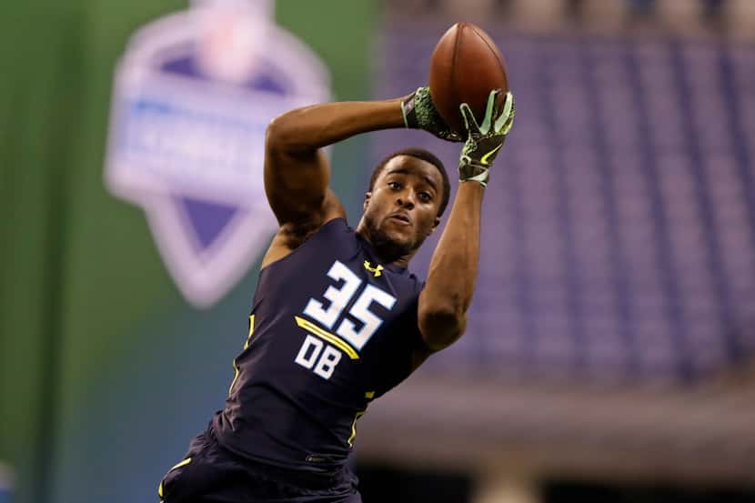 Michigan defensive back Jourdan Lewis runs a drill at the NFL football scouting combine in...