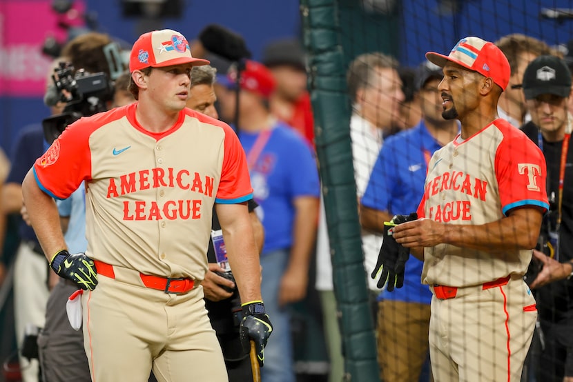 American League's Adley Rutschman, of the Baltimore Orioles (left), talks with Marcus...