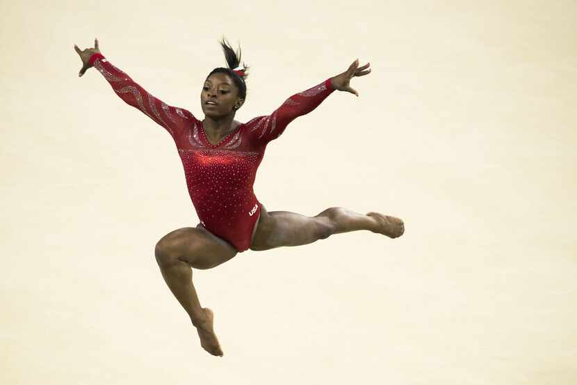 USA gymnast Simone Biles of Houston practices her floor exercise routine during a training...