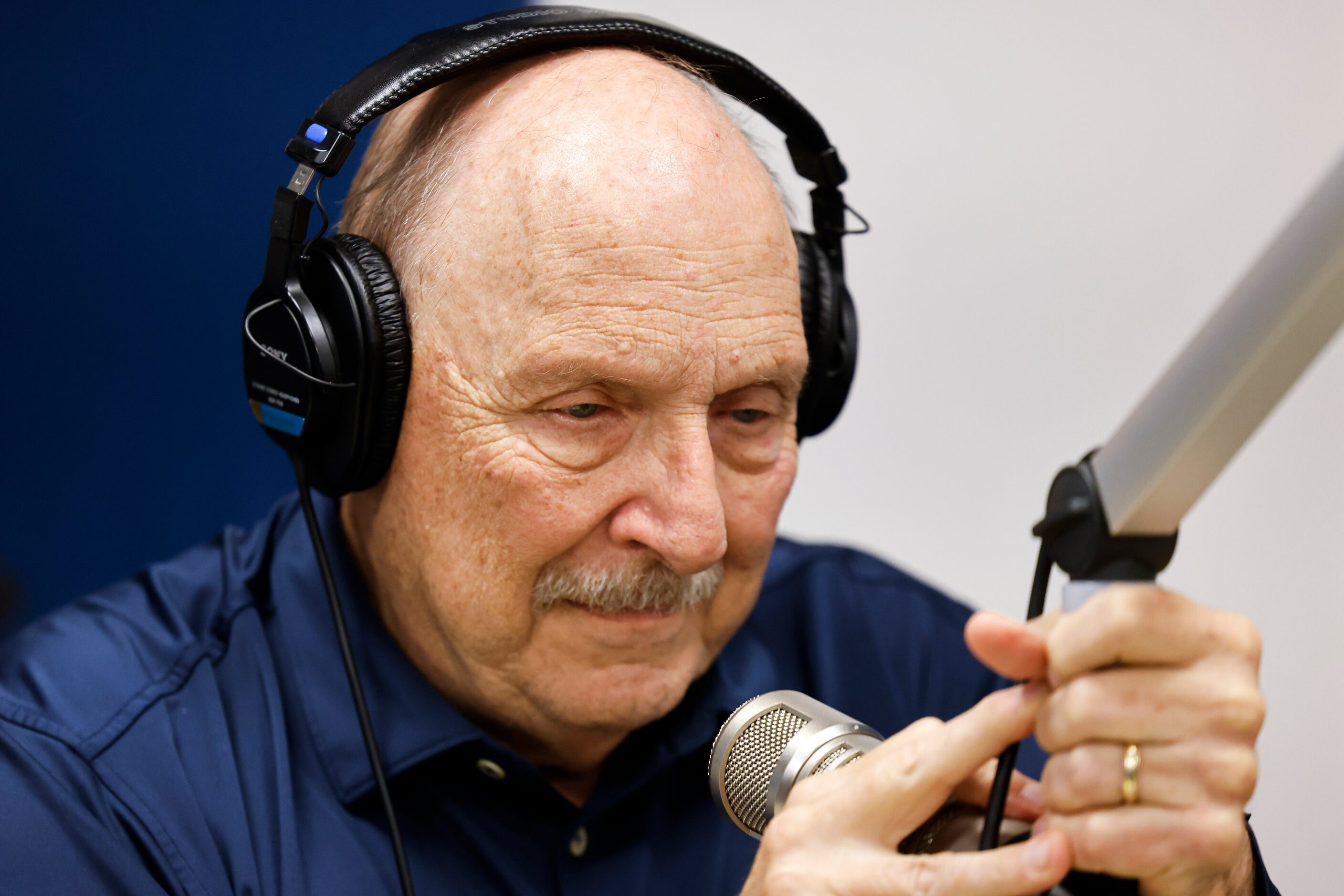 Local sports radio legend Norm Hitzges adjusts his microphone for the last time after a...