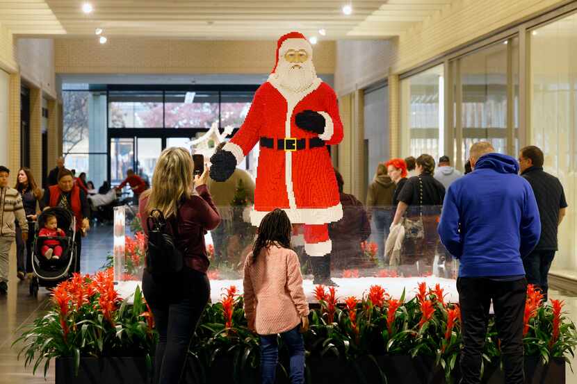 Shoppers stop by a LEGO Santa at NorthPark Center in Dallas on the Thursday before Christmas.