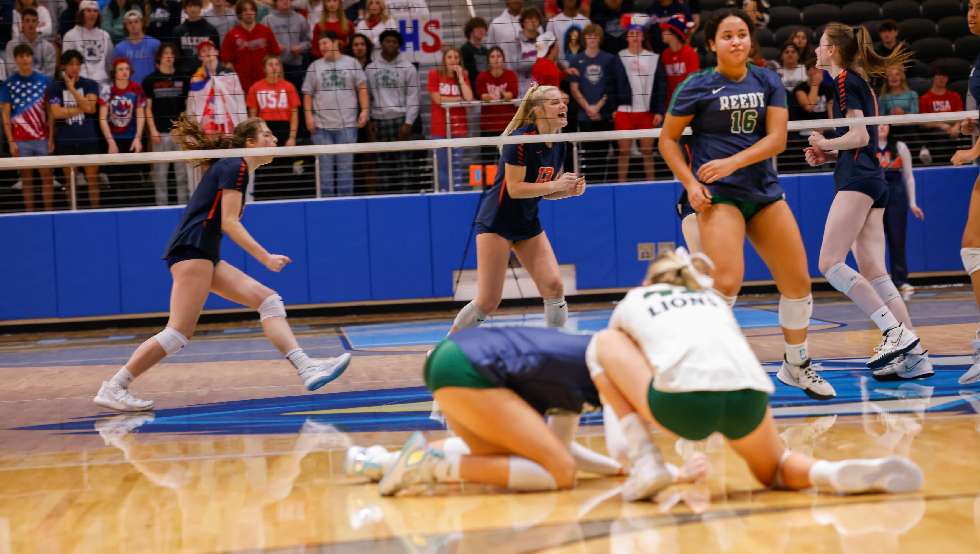 Frisco Wakeland players celebrate gaining a point against Frisco Reedy during the second set...