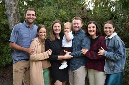 Scottie Scheffler is pictured in a family photo with wife Meredith Scheffler (from left);...