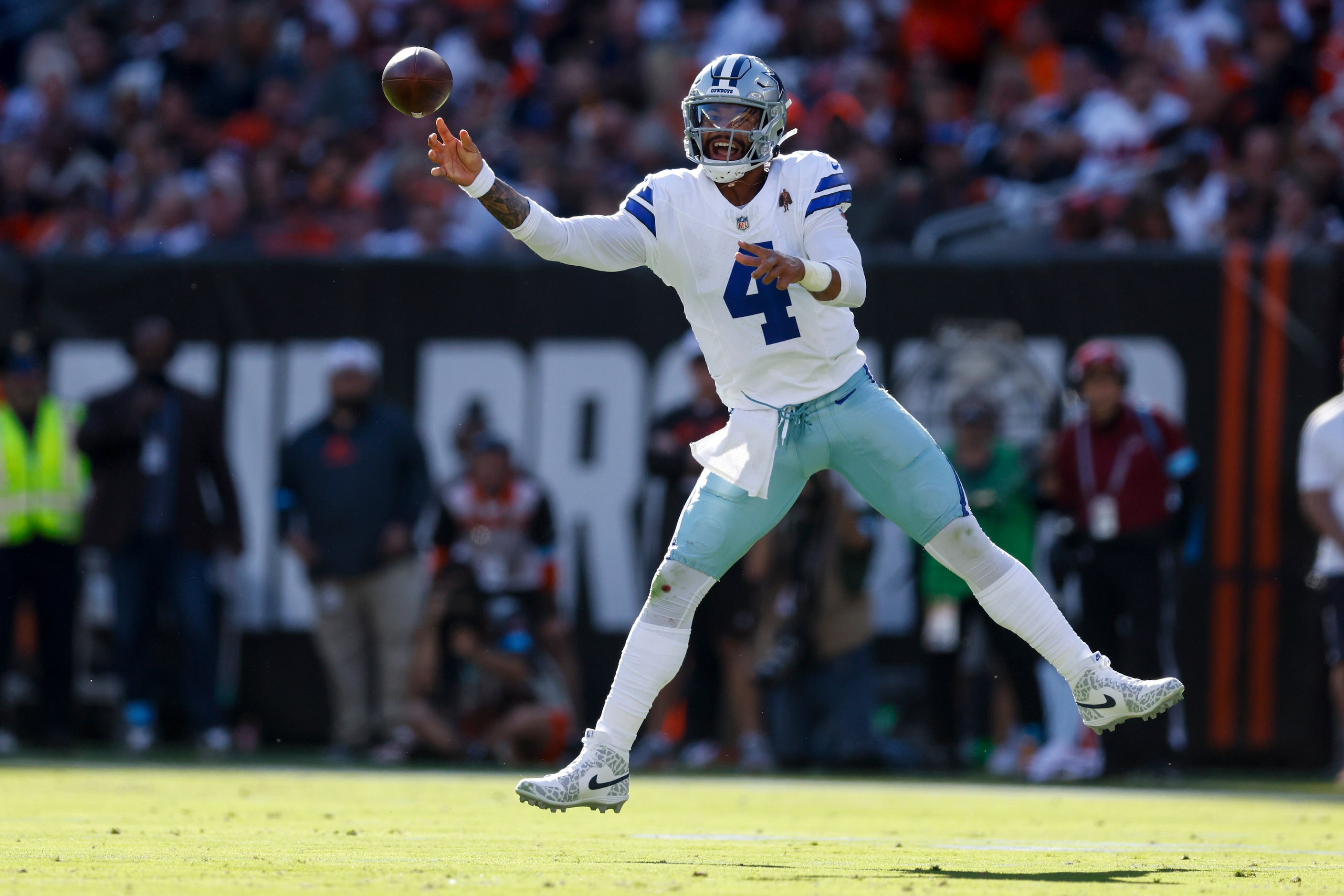 Dallas Cowboys quarterback Dak Prescott (4) throws a pass on the run during the first half...