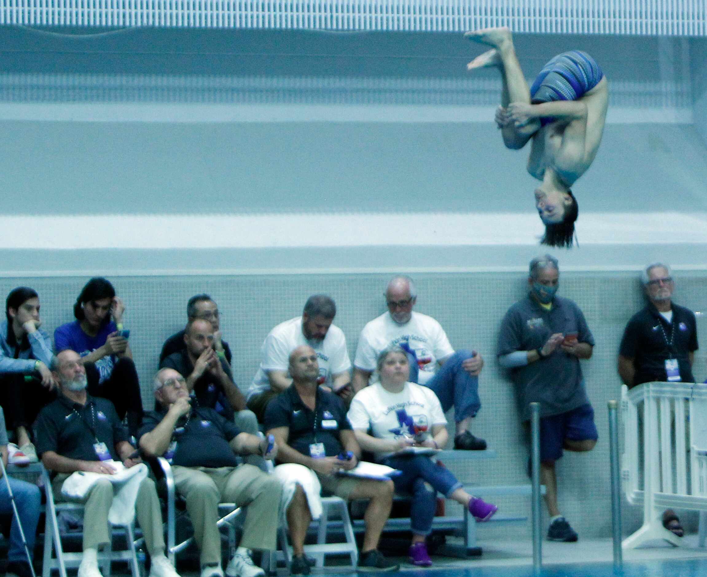 Forney diver Bryce Benson competes before judges in the Boys 5A Diving competition. The...