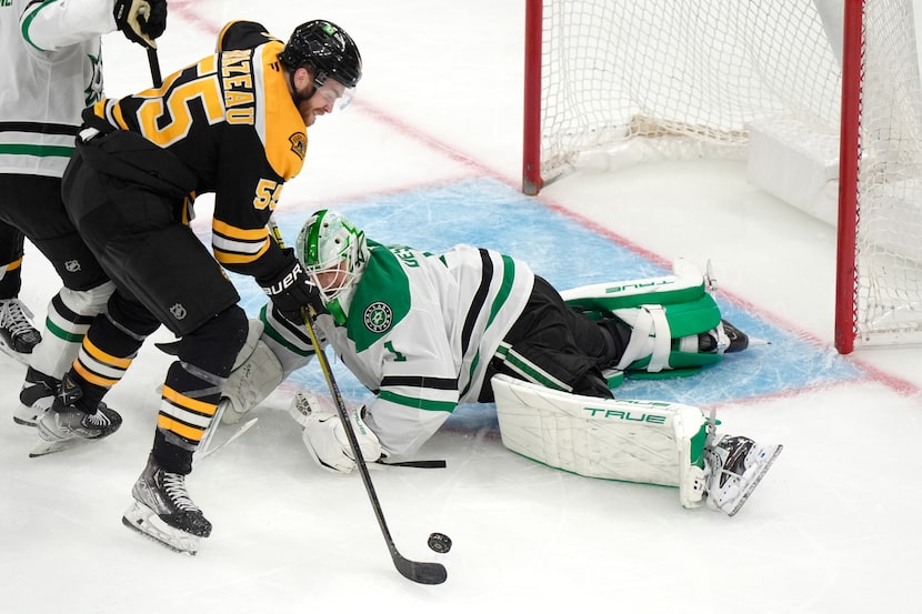 Boston Bruins right wing Justin Brazeau (55) is unable to get the puck past Dallas Stars...