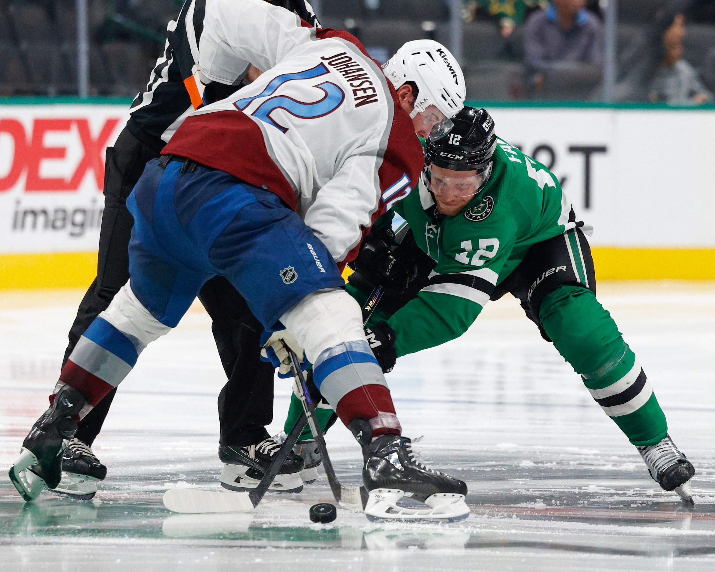 Dallas Stars center Radek Faksa (12) faces-off with Colorado Avalanche center Ryan Johansen...