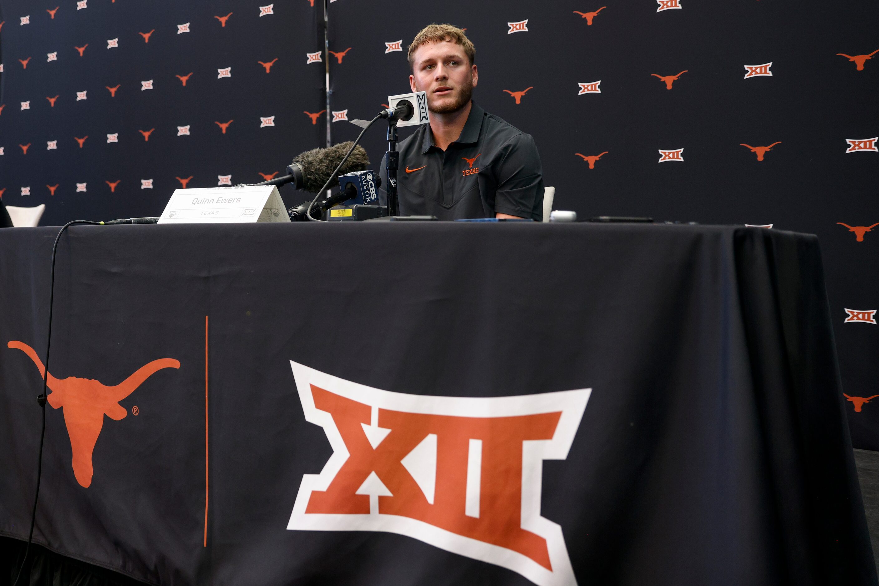 Texas quarterback Quinn Ewers speaks with reporters during the Big 12 Media Days at AT&T...