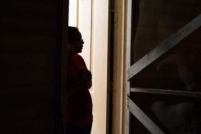 Lili, a Guatemalan immigrant, stands in the doorway of her home on Wednesday, Feb. 6, 2019,...