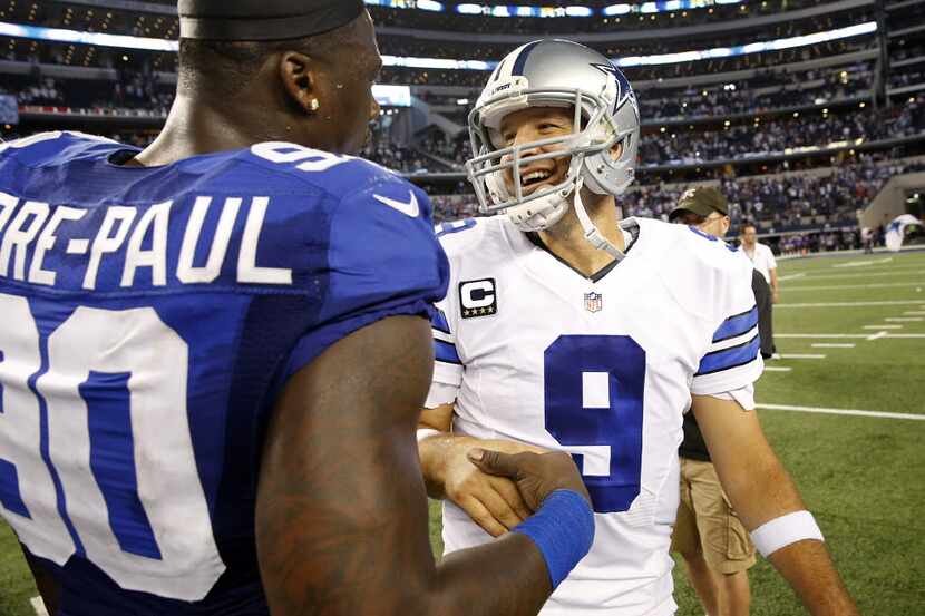 Dallas Cowboys quarterback Tony Romo (9) and New York Giants defensive end Jason Pierre-Paul...