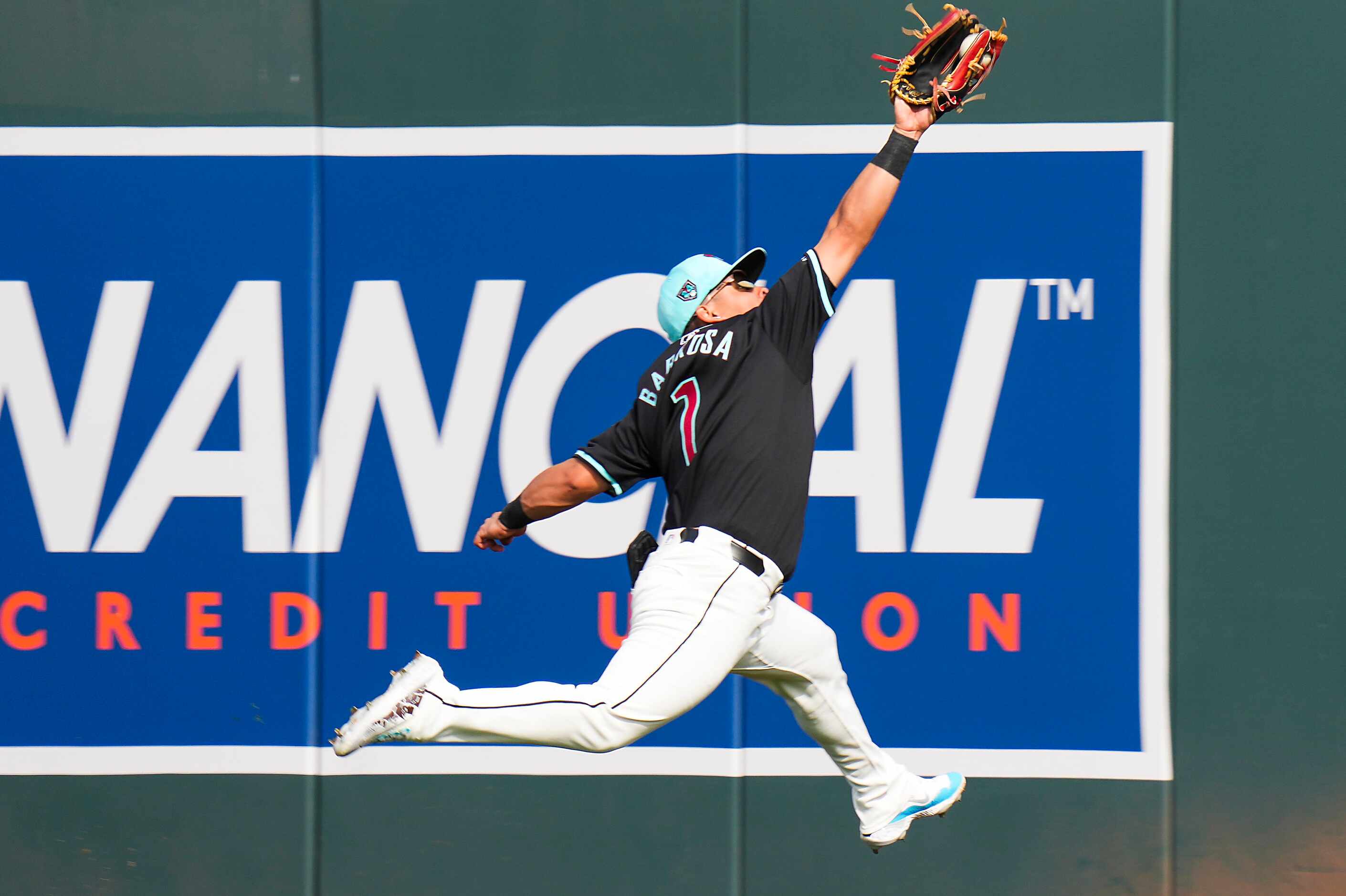 Arizona Diamondbacks outfielder Jorge Barrosa makes a leaping catch on a line drive off the...