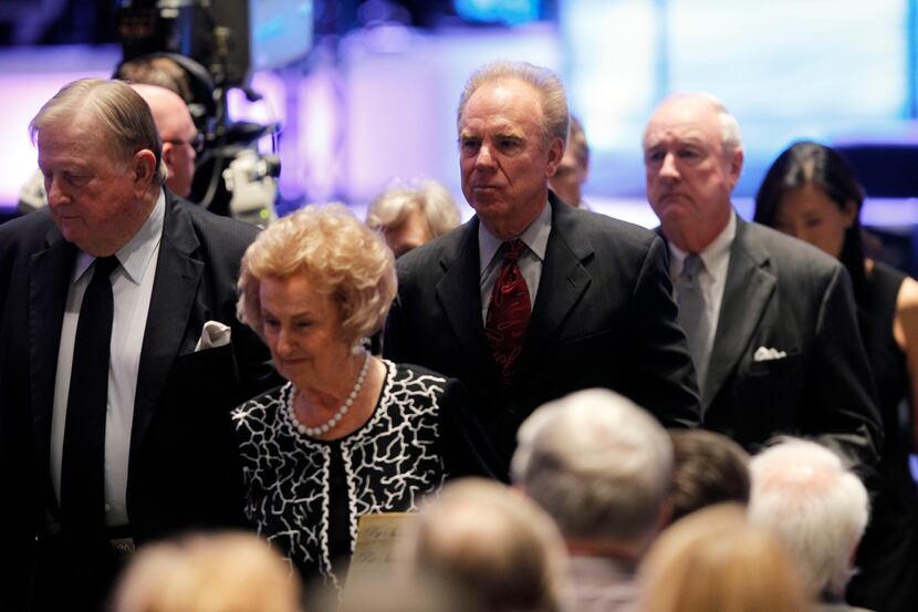 Former Dallas Cowboys player Roger Staubach departs the sanctuary following the celebration...