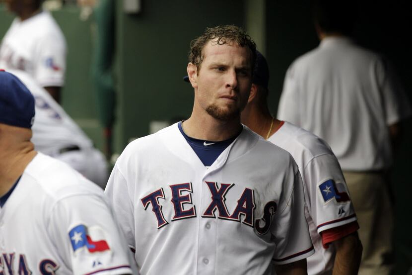 Texas Rangers' Josh Hamilton (32) walks in the dugout in the eighth inning of a baseball...