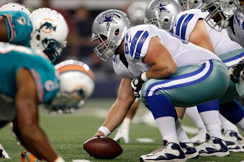 Dallas Cowboys offensive guard Phil Costa (67) prepares to snap the ball in a game against...