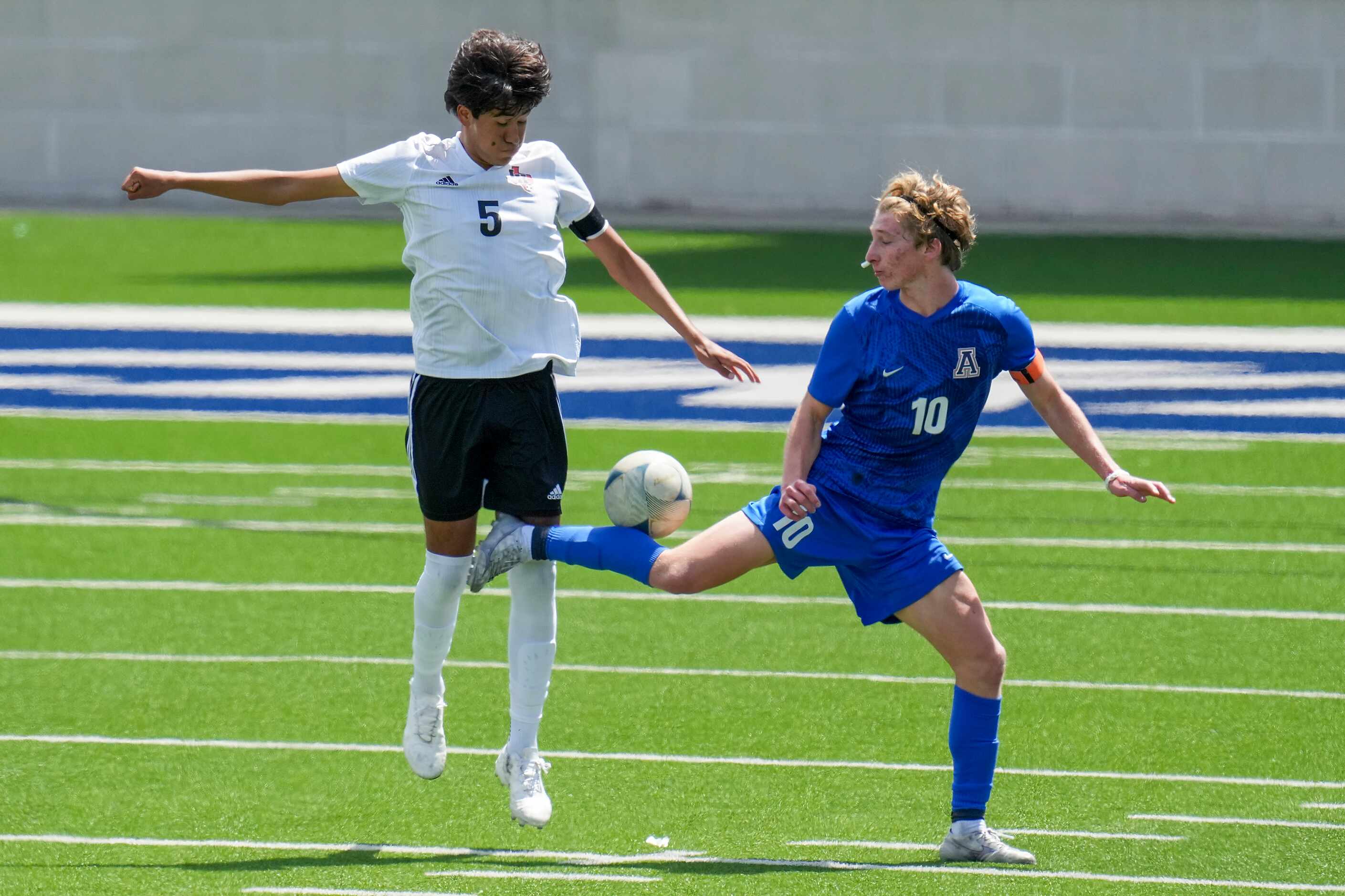 Lake Highlands defender Anthony Licea (5) challengers Allen midfielder Evan Pustejovsky (10)...