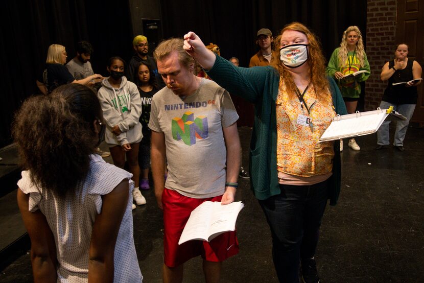 (From left) Aniah O’Neal, 13, as Fiona and Brandon Haring as Shrek listen as program...