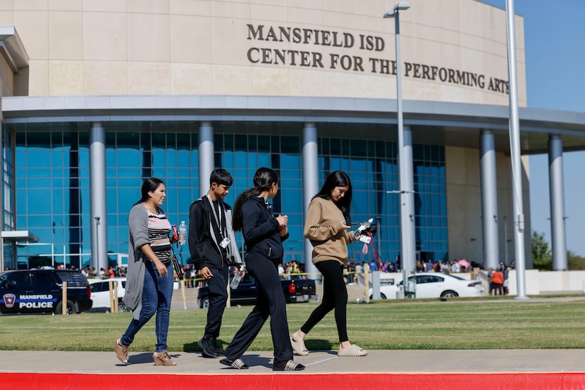 From left: Veronica Garza walks with her children, Jose Gonzalez, 15, Natalie Gonzalez, 16,...