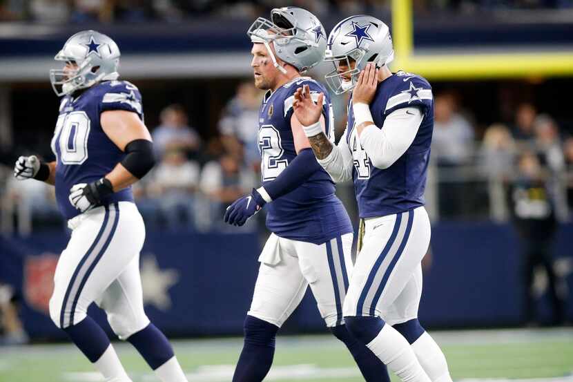 Dallas Cowboys tight end Jason Witten (82) and quarterback Dak Prescott (4) walk off the...