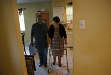  Charlie Wilson helps his wife, Debra Wilson, walk at their Duncanville home. (Jae S. Lee/...