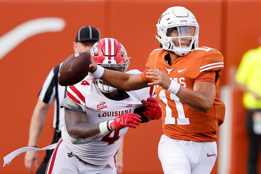Texas Longhorns quarterback Casey Thompson (11) escapes the pass rush of Louisiana-Lafayette...