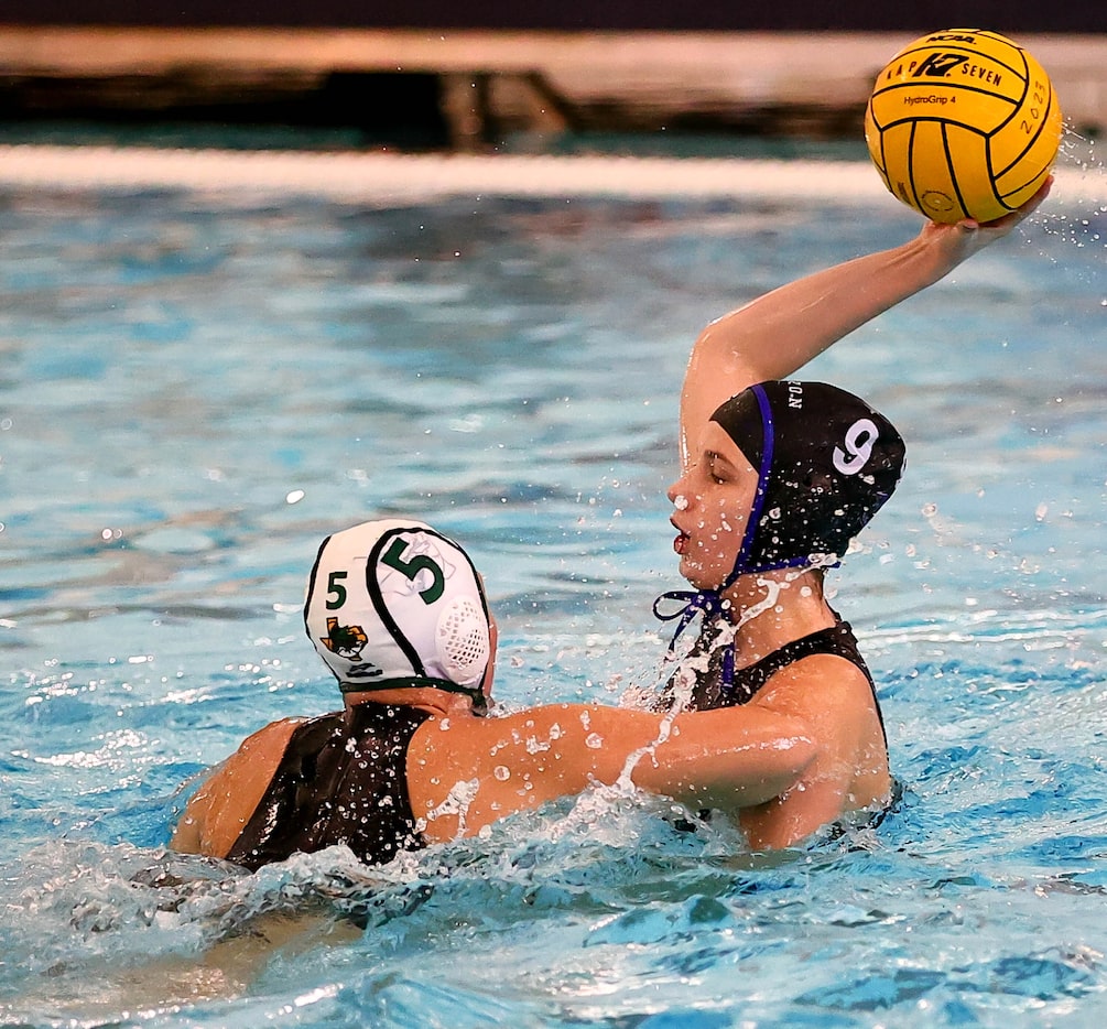 Hebron's Mia Slaughter (9) looks to make a pass against Southlake Carroll's Chloe Criswell...