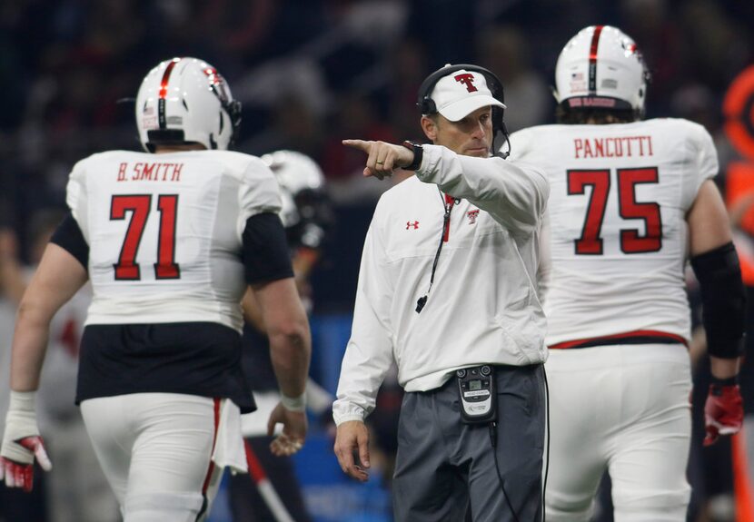 FILE - Texas Tech head coach Matt Wells makes a point between plays during first half play....