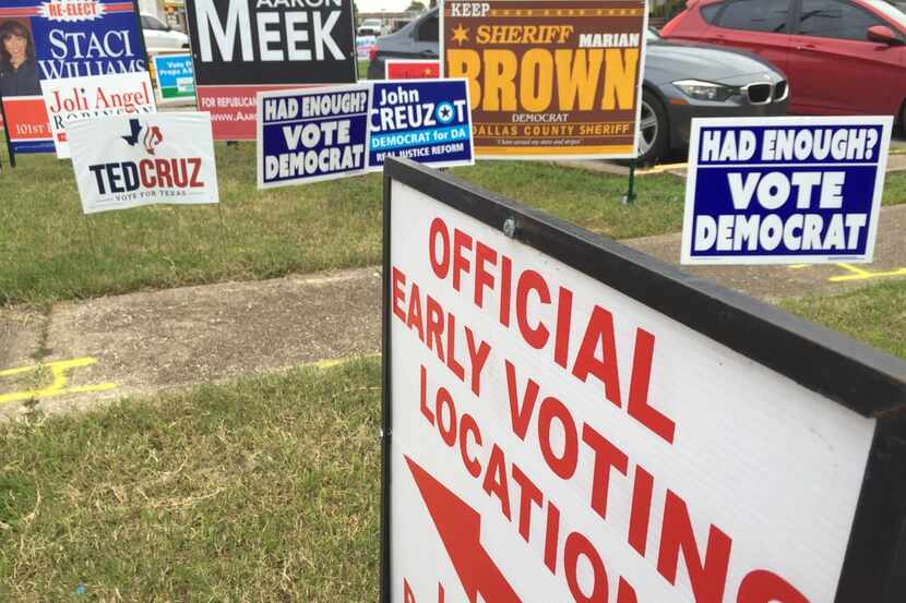 Candidates' signs stand near the Dallas County Government Center at the corner of Beckley...