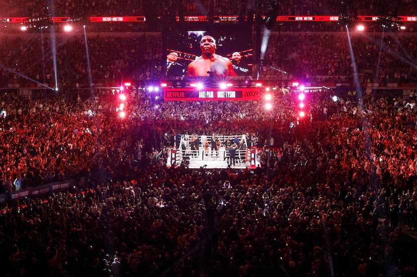 Fans fill the stadium floor before a heavyweight boxing match between Mike Tyson and Jake...