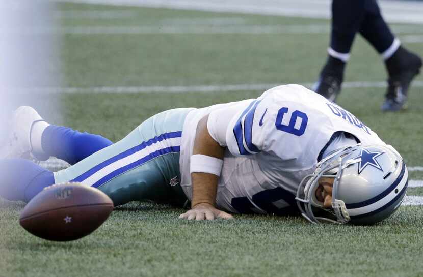 Dallas Cowboys quarterback Tony Romo  went down on a play against the Seattle Seahawks...