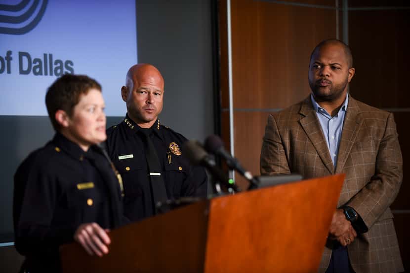 From left, Dallas Police Department Chief, Eddie Garcia and Mayor Eric Johnson peer at...
