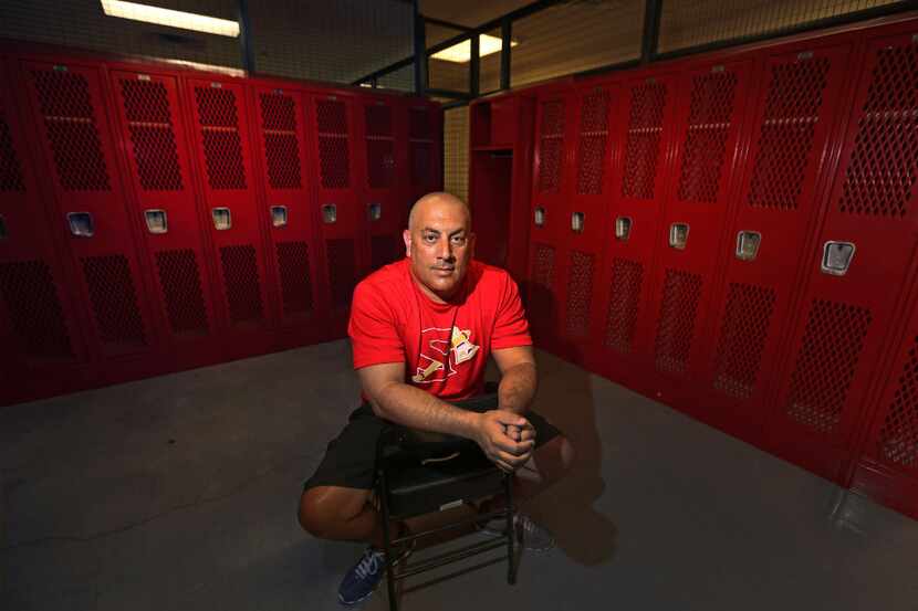 South Grand Prairie High School baseball coach Art Senato is pictured in the locker room at...