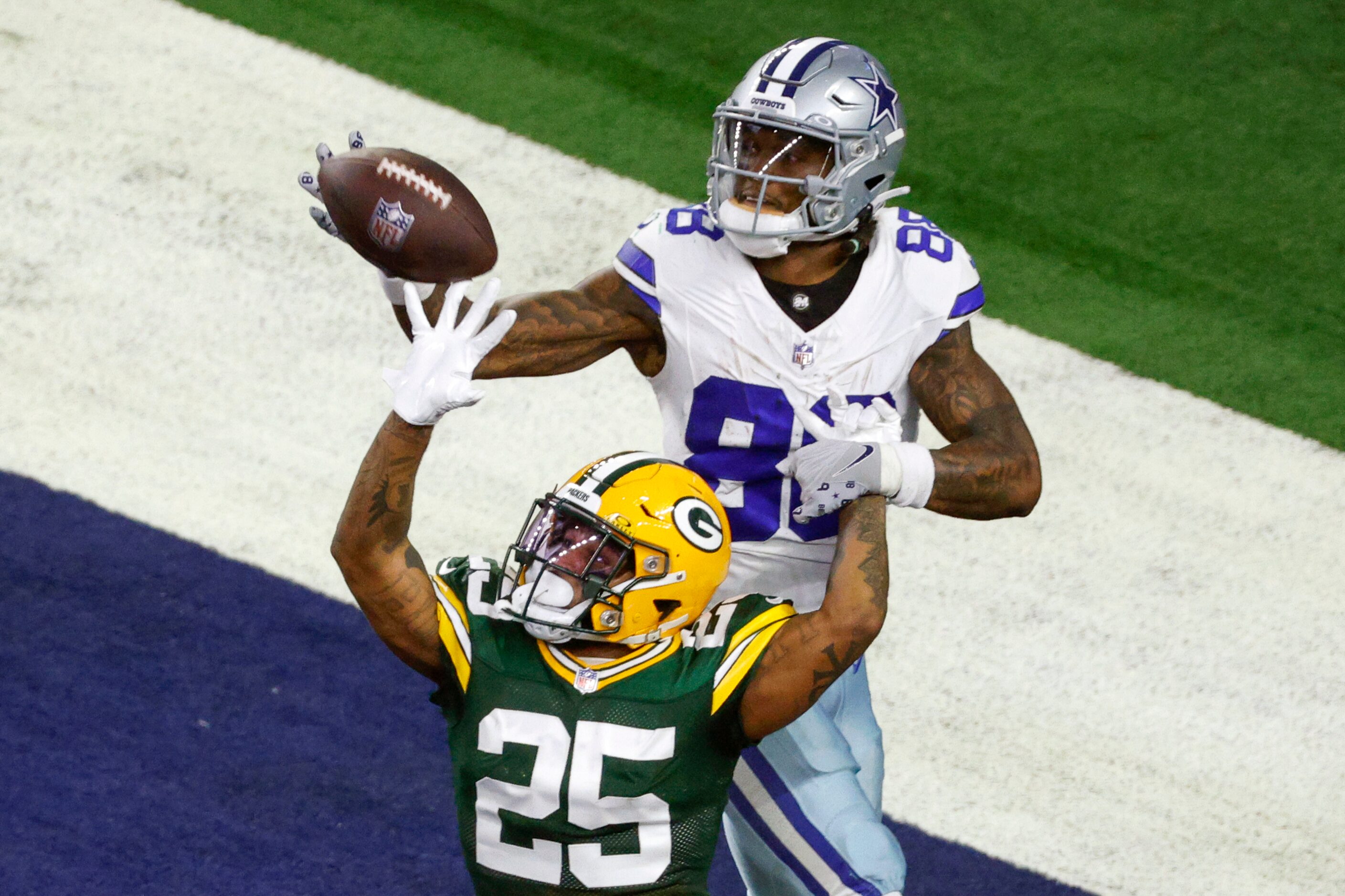 Green Bay Packers cornerback Keisean Nixon (25) breaks up a pass intended for Dallas Cowboys...