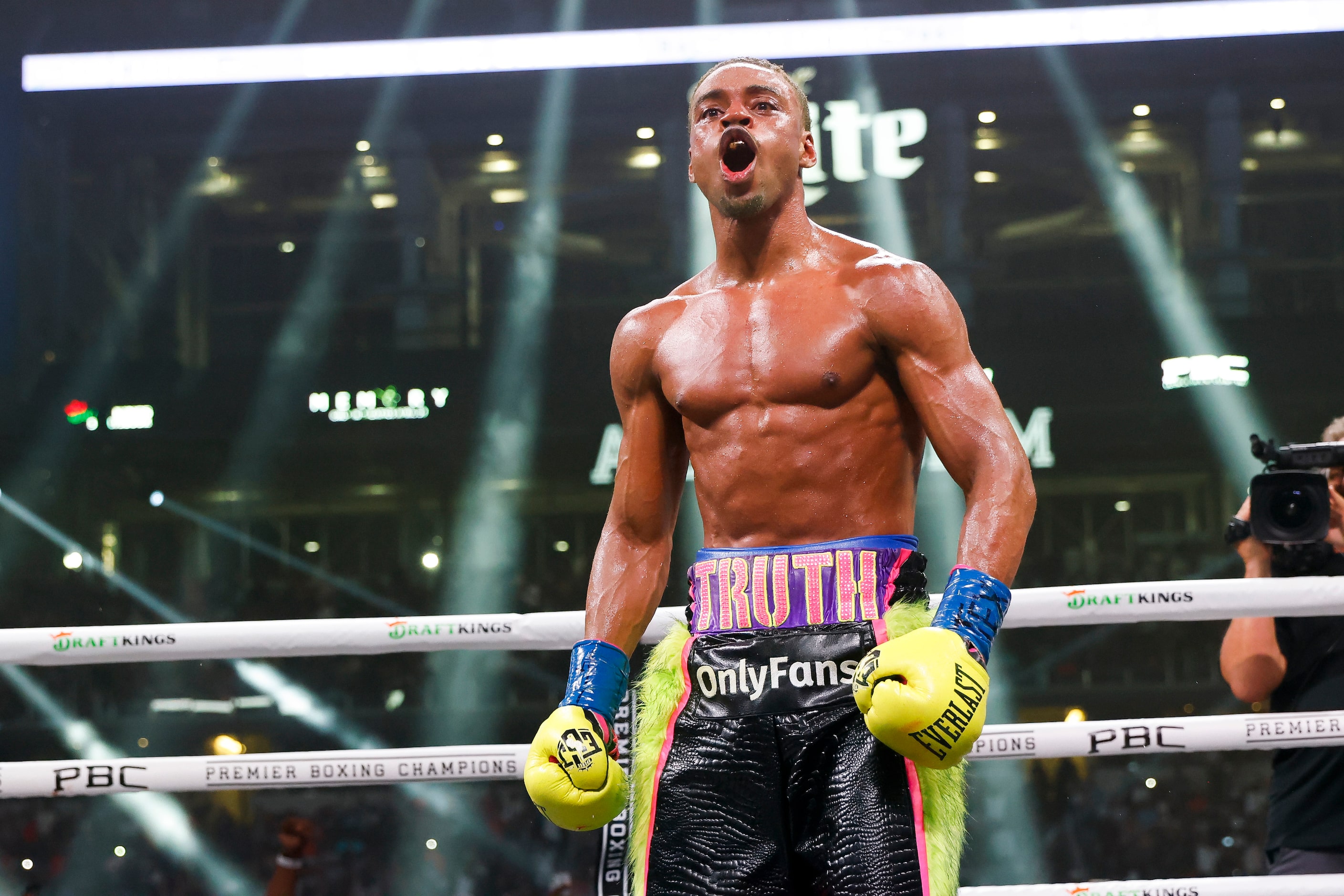 DeSoto’s Errol Spence Jr. (28-0) celebrates beating Yordenis Ugas (27-4), via a technical...